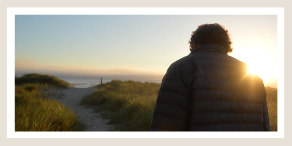Man walking towards black at sunrise